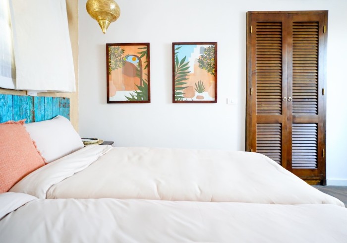 side_view_close_up_bed__paintings_room_6_-_al_wadi_gallery~~67e20b13b2ecc